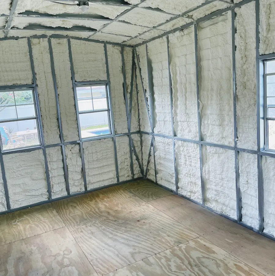 Closed-cell spray foam insulation applied to wall cavities in a residential project in Seekonk